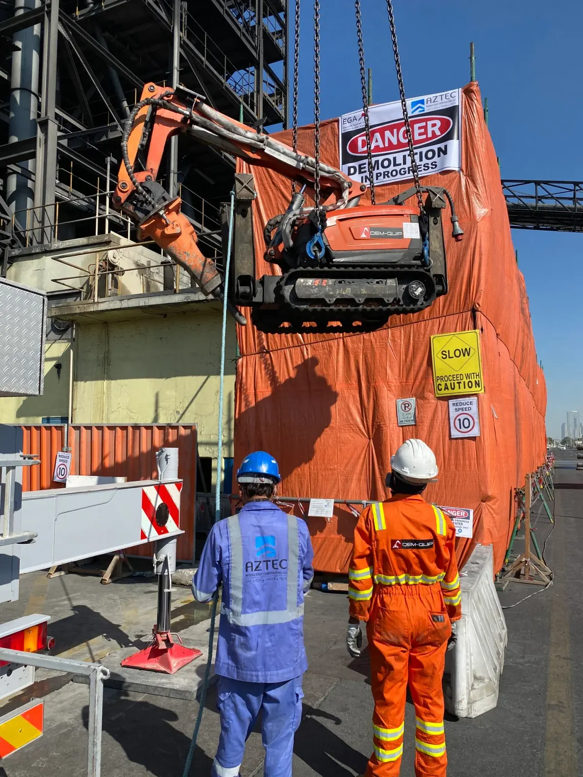 HSE-compliant demolition site with safety barriers and signage