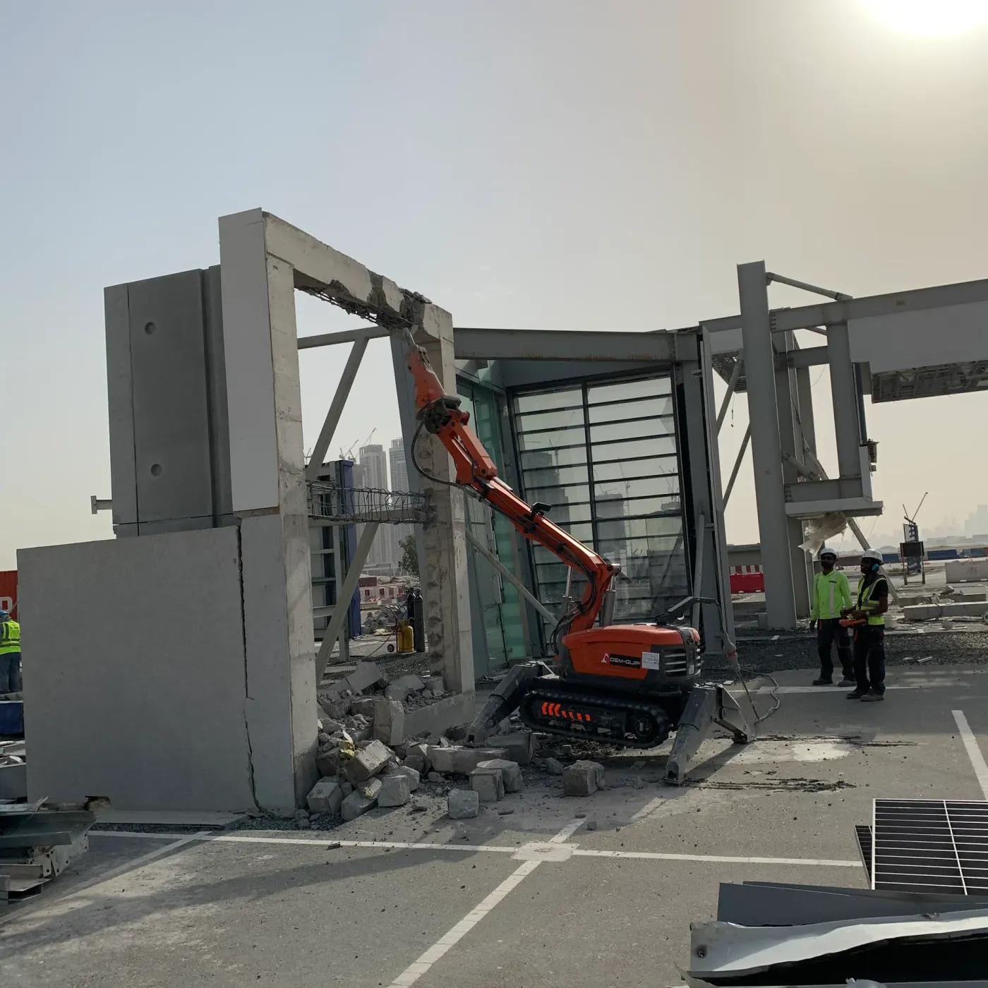 Robotic demolition machine operating on building site